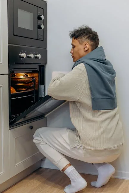 Technician Repairing An Oven's Energy Source Following A Diagnostic Process.
